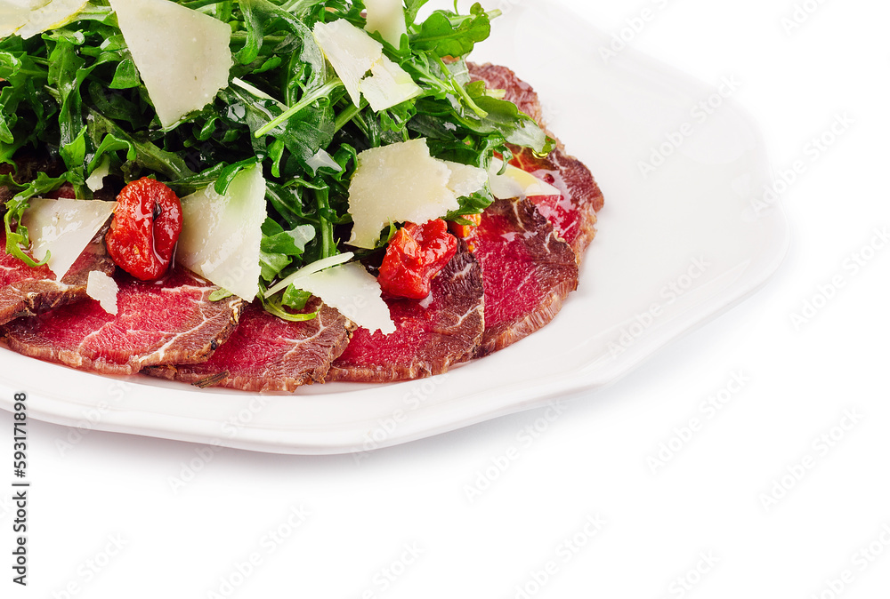 Meat carpaccio with arugula and parmesan cheese Meat carpaccio with arugula and parmesan cheese