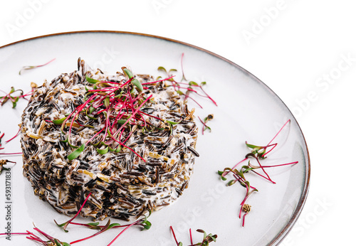 Delicious cooked black rice or risotto on plate