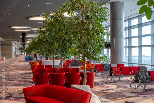 Canvas Print Spacious seating area in a departure terminal at Changi International Airport in