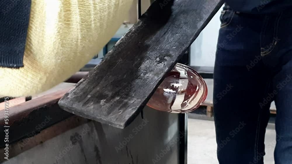 Glass blowing process jacking using jacks to create shape and open