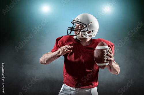 American football sportsman player with ball in action on stadiu