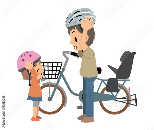 自転車用のヘルメットを被るお父さんと娘