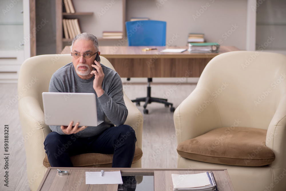 Old male employee working from home during pandemic Old male employee working from home during pandemic