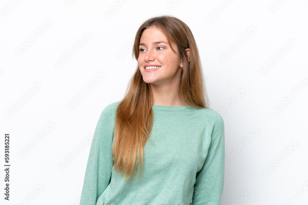 Young caucasian woman isolated on white background looking to the side and smiling Young caucasian woman isolated on white background looking to the side and smiling