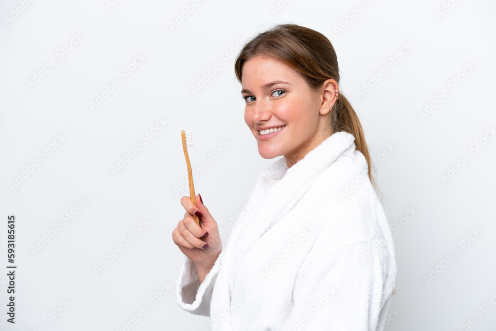 Young caucasian woman brushing teeth isolated on white background smiling a lot Young caucasian woman brushing teeth isolated on white background smiling a lot