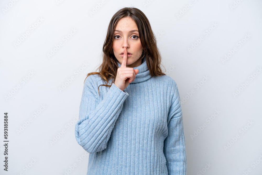 Young caucasian woman isolated on white background showing a sign of silence gesture putting finger in mouth Young caucasian woman isolated on white background showing a sign of silence gesture putting finger in mouth