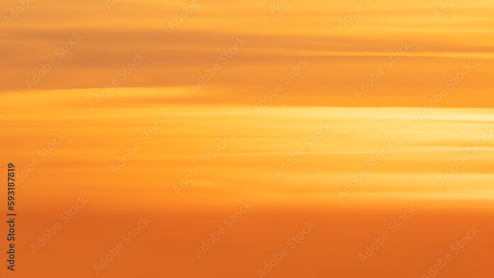 Panorama of the orange evening sky. Real majestic sunrise sundown sky background without birds.