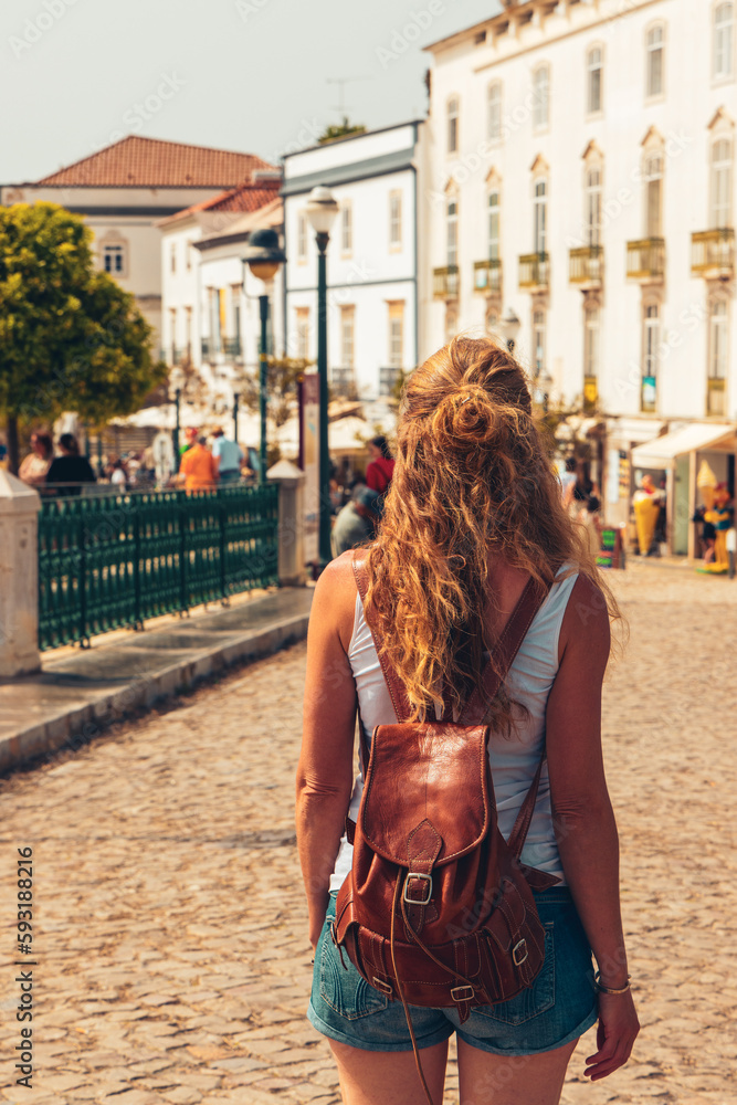woman walking in the street of Tavira- Travel in Algarve,  tour tourism in Portugal