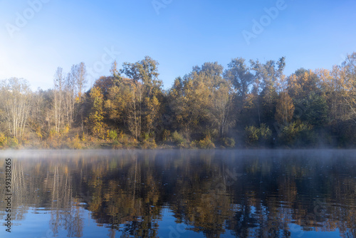 Fog-covered river in the autumn season