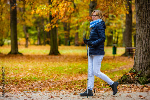 Nordic walking - woman training in city park  © Jacek Chabraszewski