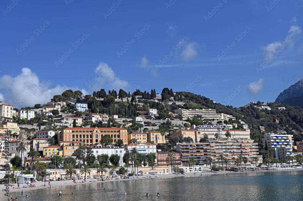 Beach and hill with old buildings in Menton France