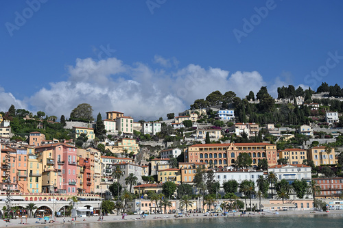 Beach with palm trees in Menton France summer season