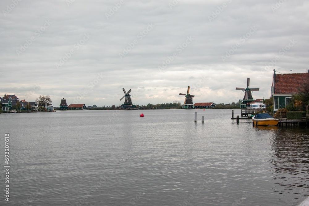Windmills and wooden houses in the Zaanse Schans, Zaanstad, Netherlands. Windmills and wooden houses in the Zaanse Schans, Zaanstad, Netherlands.