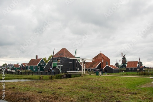 Windmills and wooden houses in the Zaanse Schans, Zaanstad, Netherlands.
