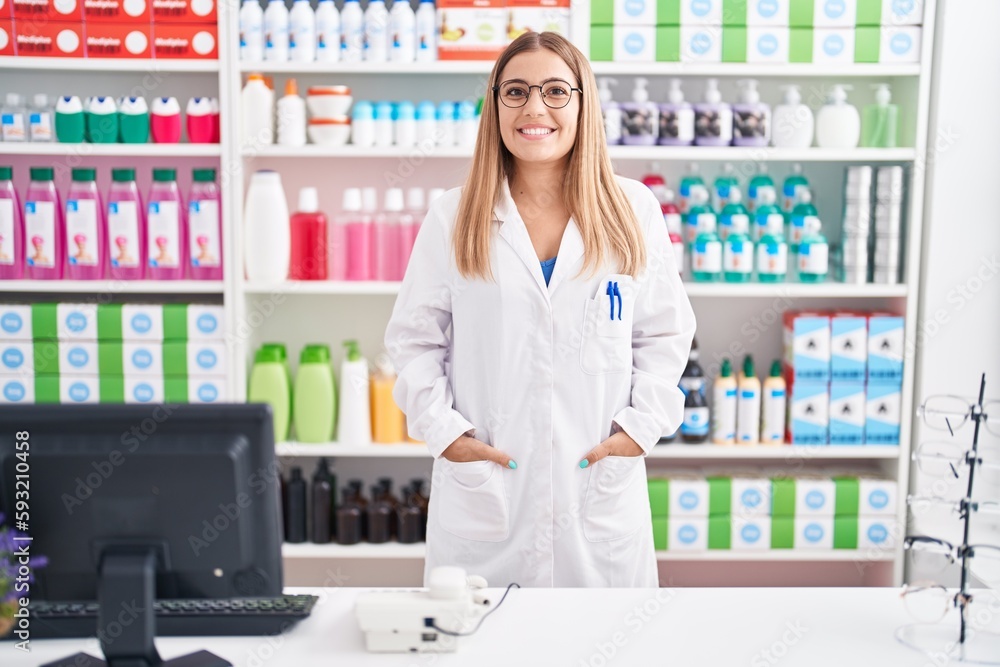 Young beautiful hispanic woman pharmacist smiling confident standing at pharmacy Young beautiful hispanic woman pharmacist smiling confident standing at pharmacy