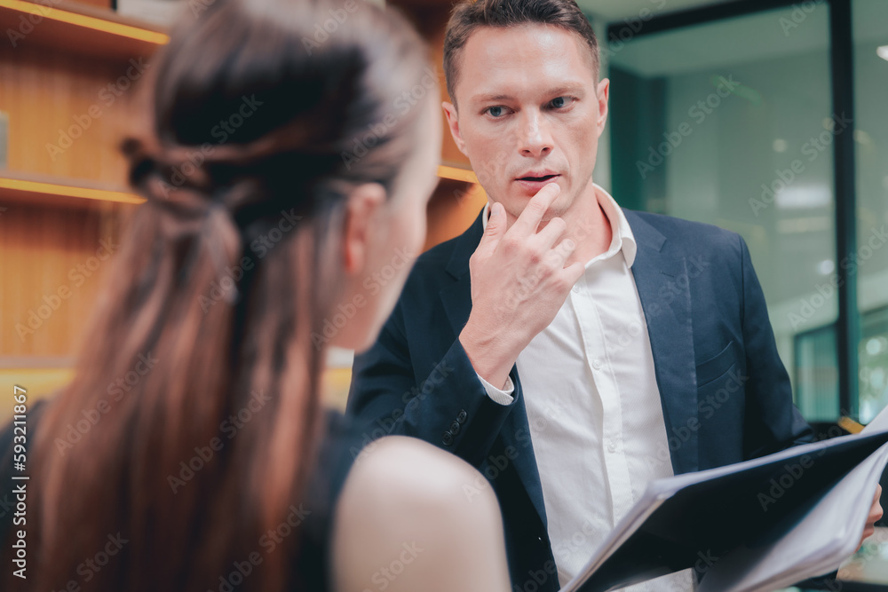 Two Businessman and businesswoman or colleague staff working in office Two Businessman and businesswoman or colleague staff working in office