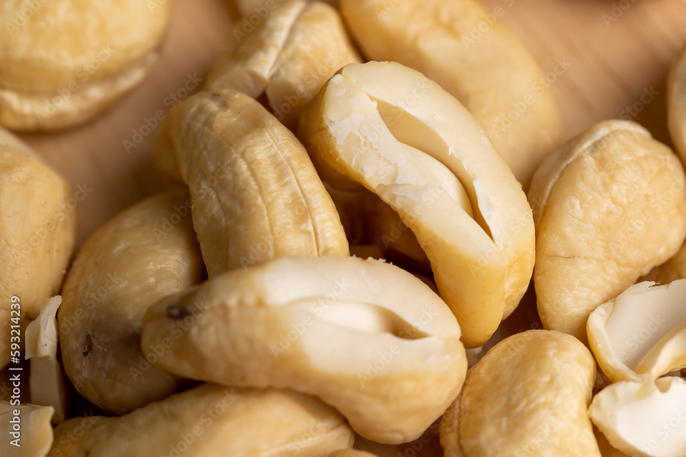 scattered pile of cashew nuts scattered pile of cashew nuts