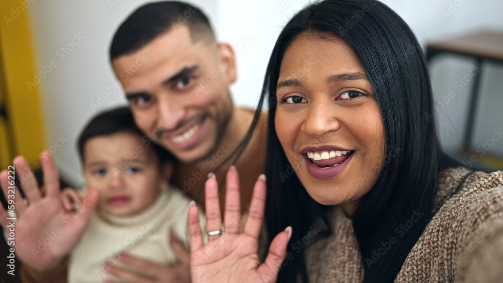 Couple and son make selfie by camera sitting on sofa at home Couple and son make selfie by camera sitting on sofa at home