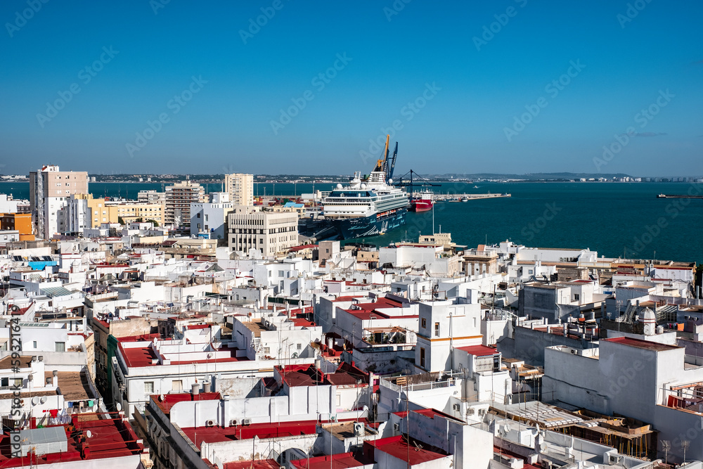 Aerial top view of the roofs of Cadiz and the ocean. Andalusia, Spain