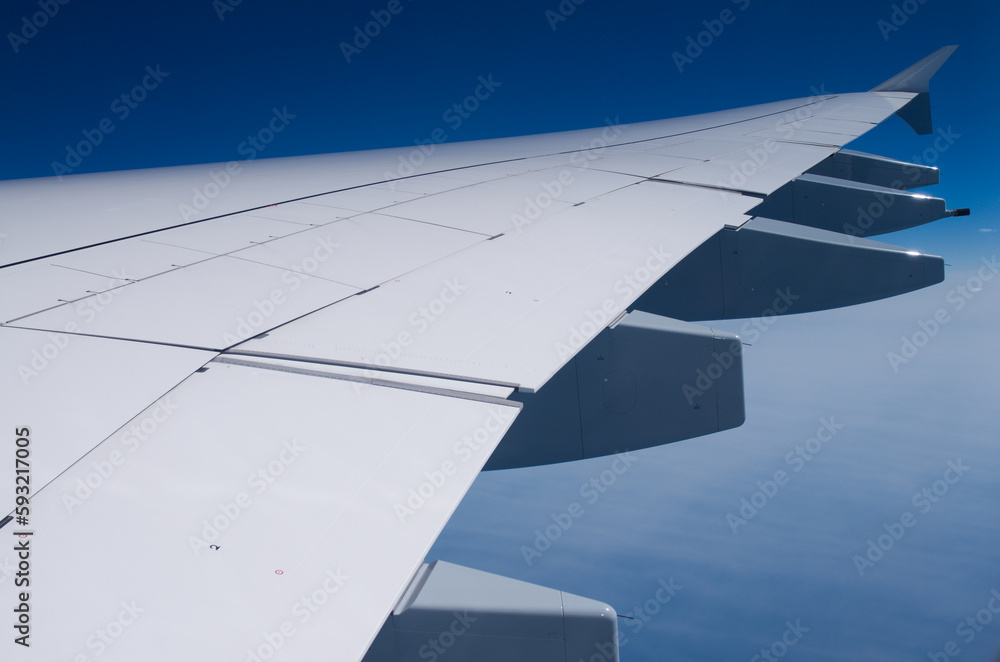 Obraz premium wing of Airbus A370 airplane in sky