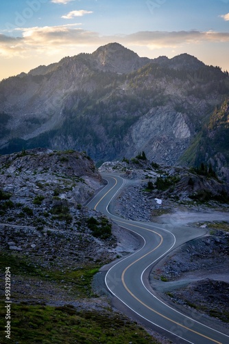 Vertical high-angle view of a long curvy road in the mountains