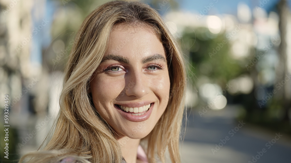 Young blonde woman smiling confident standing at street Young blonde woman smiling confident standing at street