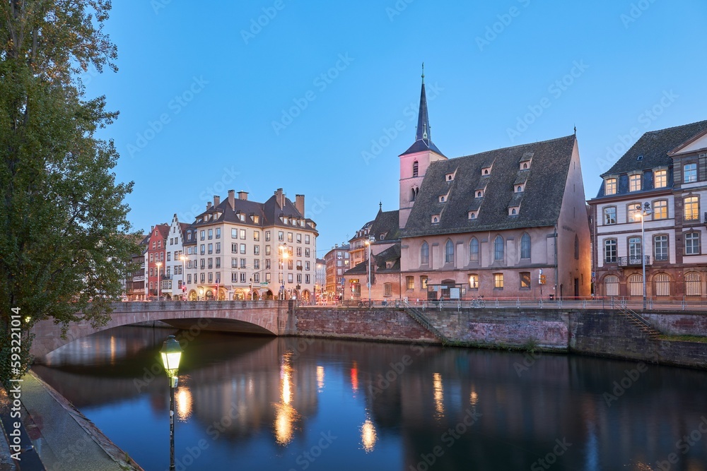 Beautiful view of traditional buildings near the tranquil Ill river in Strasbourg, France