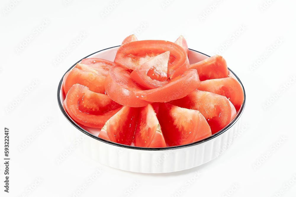 Closeup of cut tomatoes in a bowl isolated on a white background. Closeup of cut tomatoes in a bowl isolated on a white background.