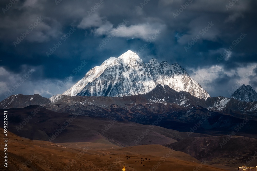 View gloomy cloudy sky above the snow covered mountains. The Himalayas.