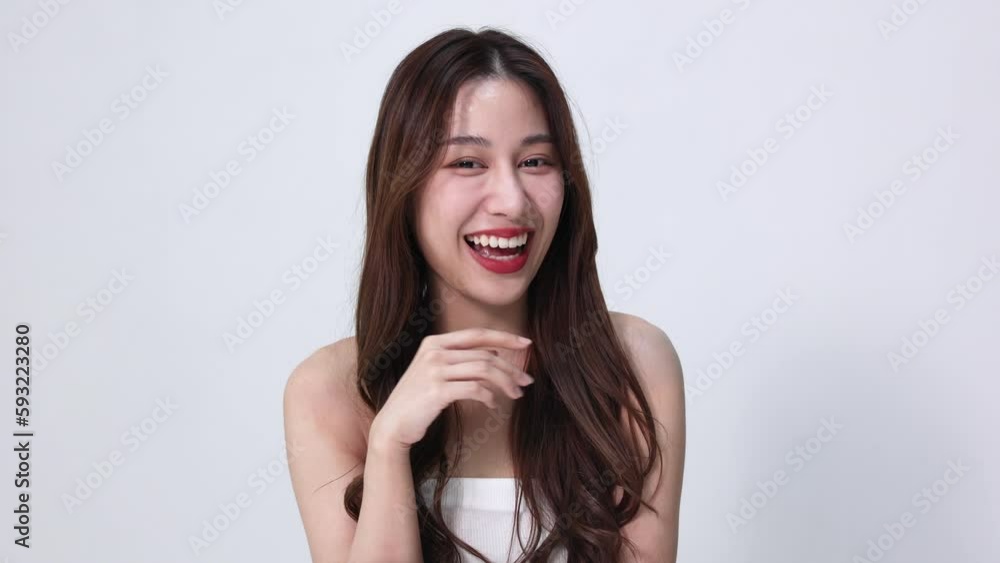 Closeup portrait of a face of the young Asian girl with a healthy facial skin. Beautiful woman with clean skin care in studio background. Skin care concept Closeup portrait of a face of the young Asian girl with a healthy facial skin. Beautiful woman with clean skin care in studio background. Skin care concept