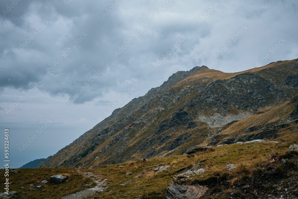 Beautiful view of the mountainous landscape under a cloudy sky Beautiful view of the mountainous landscape under a cloudy sky