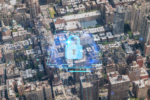 Aerial top view of New York City building roofs. Bird's eye view from helicopter of metropolis cityscape. The concept of cyber security to protect confidential information, padlock hologram © VideoFlow