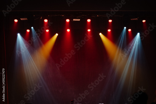 Empty stage lit up in various lights photo