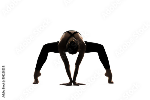 Woman in a yoga pose is doing a yoga asana pose on a white background
