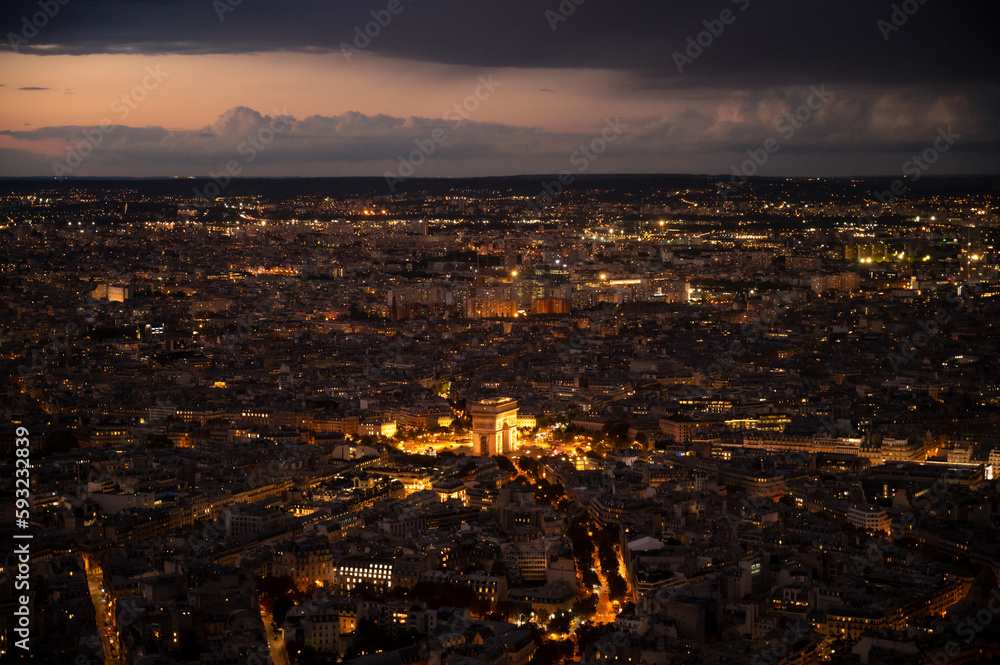 Obraz premium High Resolution Panorama Of Paris Skyline from Eiffel Tower during rainy sunset.