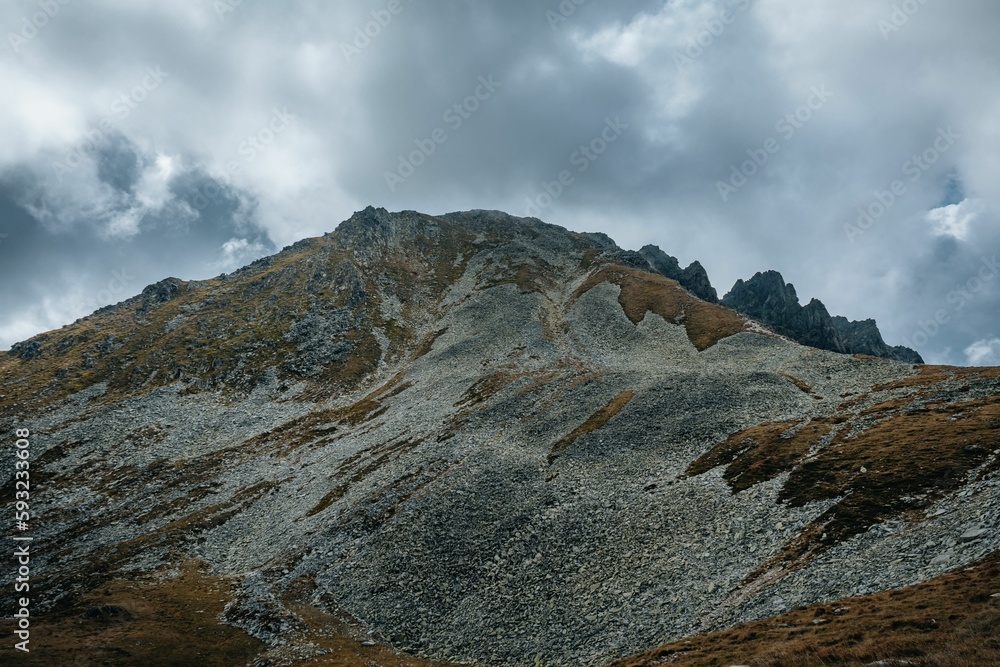 Fototapeta premium Rocky mountains in summer on a cloudy day