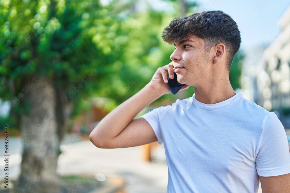 Young hispanic teenager smiling confident talking on the smartphone at park Young hispanic teenager smiling confident talking on the smartphone at park