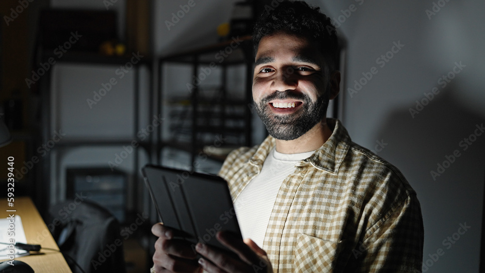 Young hispanic man business worker using touchpad working at office Young hispanic man business worker using touchpad working at office