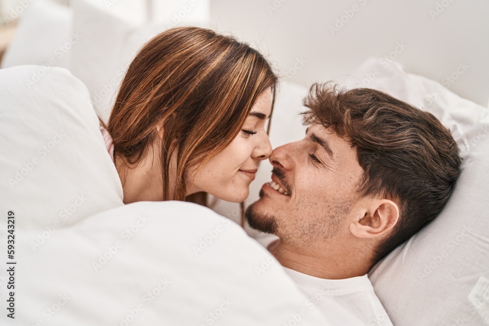 Mand and woman couple smiling confident lying on bed at bedroom Mand and woman couple smiling confident lying on bed at bedroom