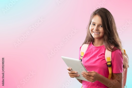 a happy little school girl posing