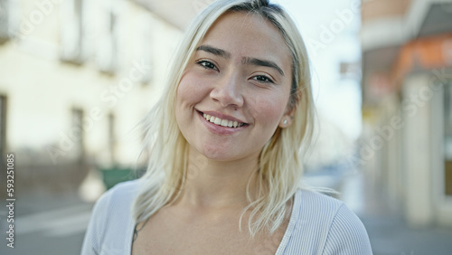 Young beautiful hispanic woman smiling confident standing at street Free Download Young beautiful hispanic woman smiling confident standing at street - GFXLoad