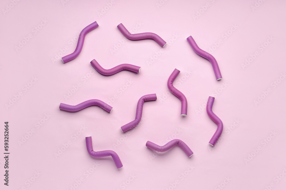 Hair curlers on pink background Hair curlers on pink background