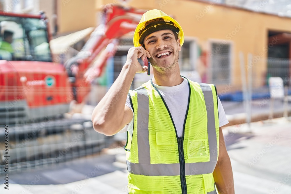 Young hispanic man architect smiling confident talking on smartphone at park Young hispanic man architect smiling confident talking on smartphone at park