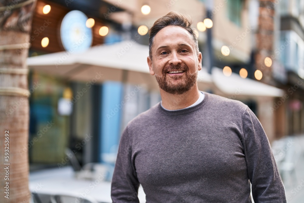 Young caucasian man smiling confident standing at coffee shop terrace Young caucasian man smiling confident standing at coffee shop terrace