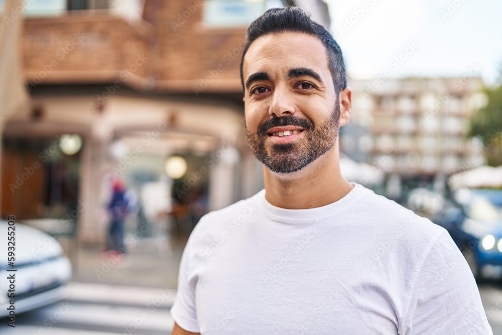 Young hispanic man smiling confident standing at street Young hispanic man smiling confident standing at street