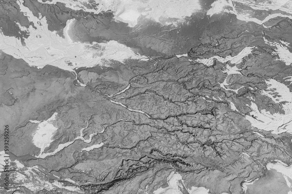 The structure of cracked wet earth at the bottom of the lake, creating irregular patterns, structure, background. Amazing shapes created by nature at the bottom of a lake where there is no water The structure of cracked wet earth at the bottom of the lake, creating irregular patterns, structure, background. Amazing shapes created by nature at the bottom of a lake where there is no water