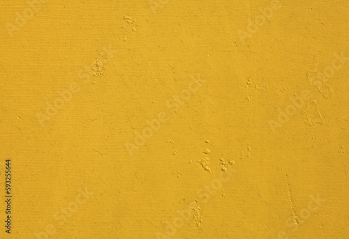Yellow wall, texture, background. The wooden wall, painted with enamel paint. Flat surface in yellow color. Smooth and glossy surface with a yellow tint © Roden_W