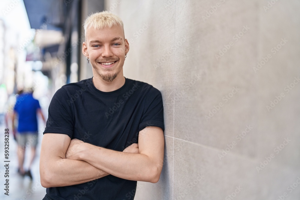 Young caucasian man smiling confident standing with arms crossed gesture at street Young caucasian man smiling confident standing with arms crossed gesture at street