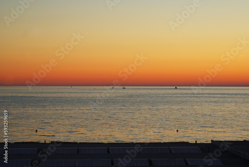 Sunset over the sea, sun glare on the water, background