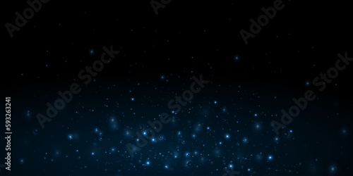 Dust particle glow. Energy flow on a black background. Abstract background of particles.